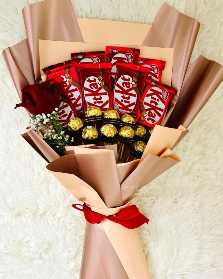 Chocolate bouquet with KitKat and Ferrero Rocher, wrapped in brown paper.